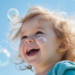 Joyful toddler laughing with floating soap bubbles, sunny blue sky backdrop, happy childhood play. AI Generative