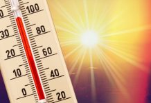 Zon en uitslaande thermometer