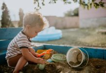 boy sand hot daycare playground