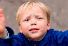 kid wants to grab the camera